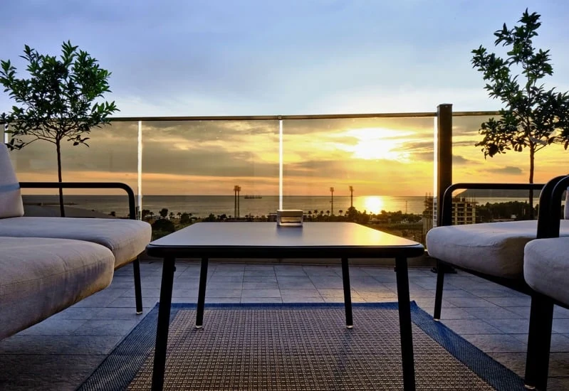 Outdoor terrace overlooking the sea at sunset